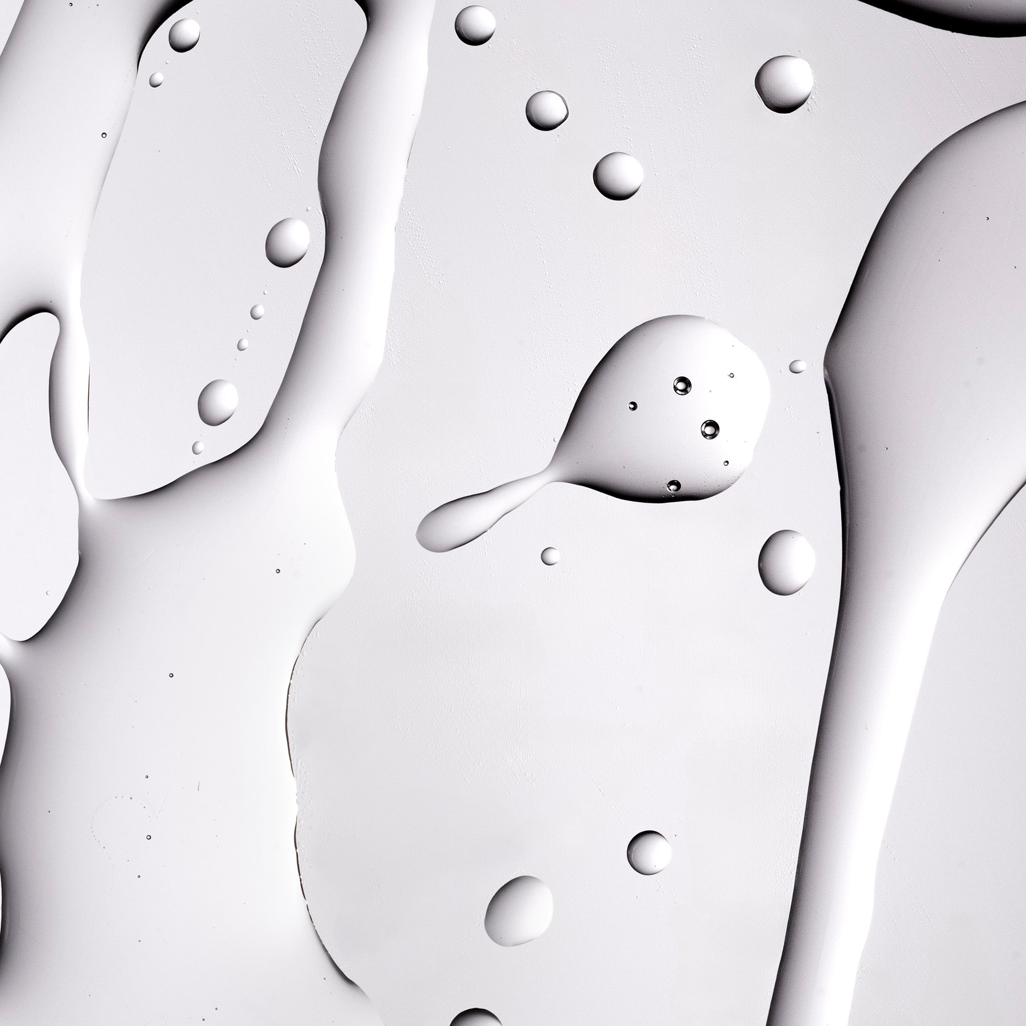 A close up shot of The Body Shop Tea Tree Oil texture on a grey background