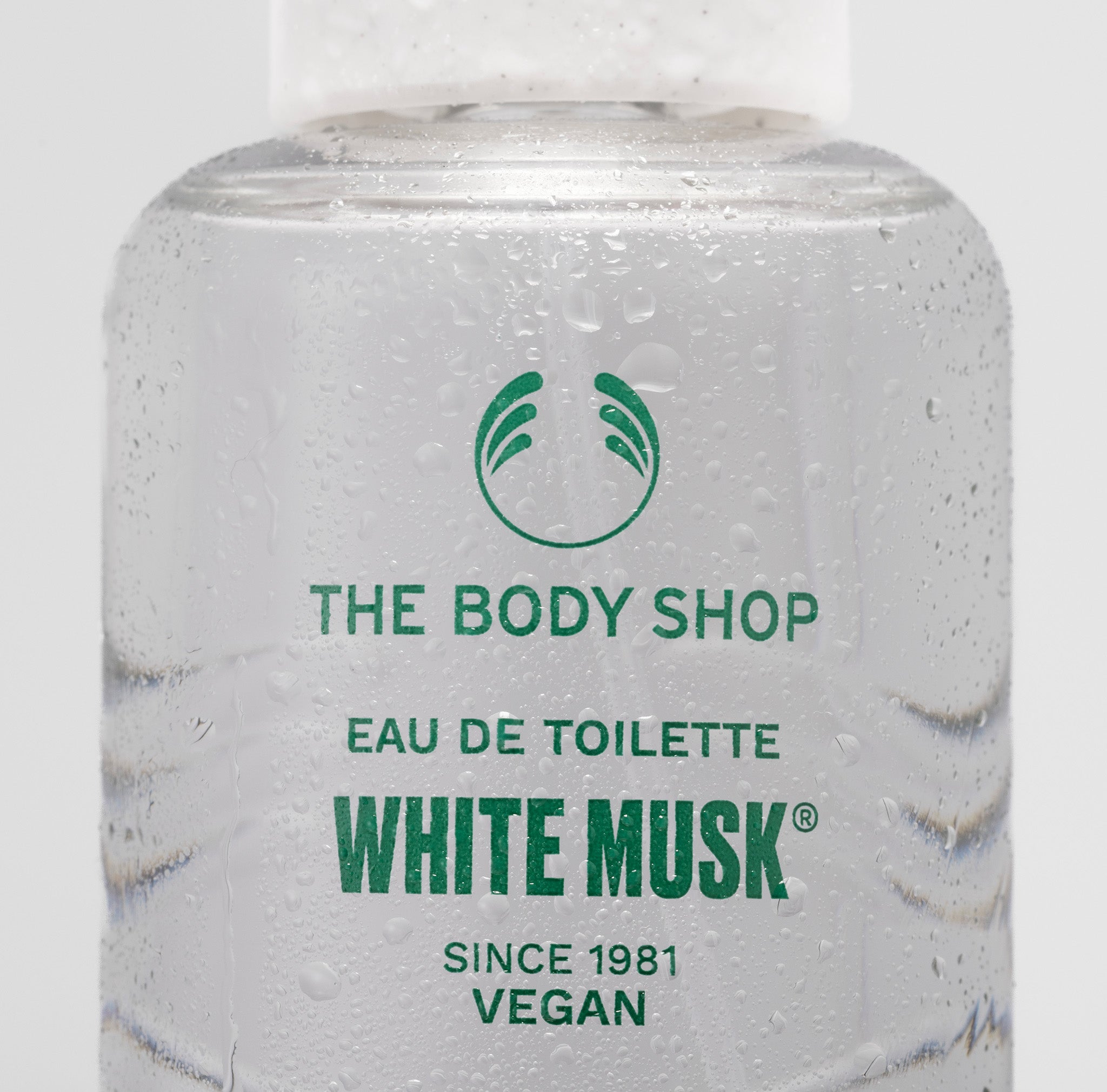 The Body Shop White Musk Eau de Toilette bottle with green text on a white background